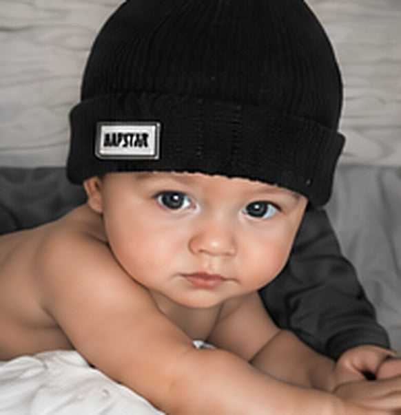 Baby in a black Napstar beanie