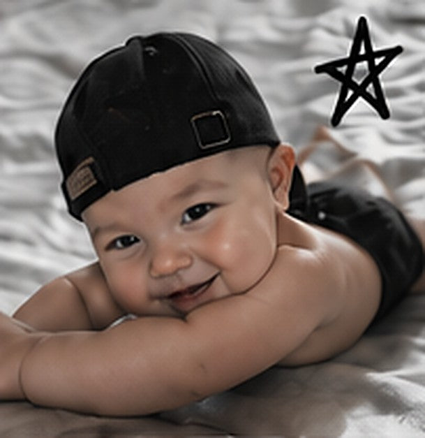 Baby in a backwards cap